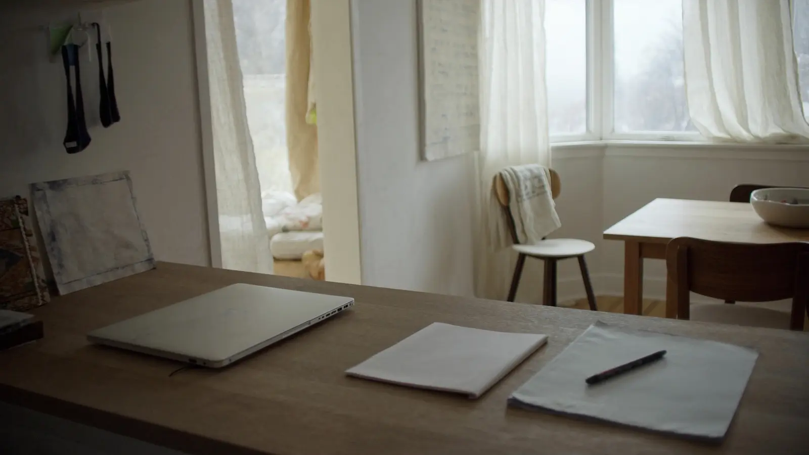 A home work area beside an everyday living space.